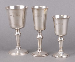 A silver goblet Birmingham 1973 15cm, 1 other Birmingham 1976 by W I Broadway and Company and 1 other silver goblet, 372g gross 