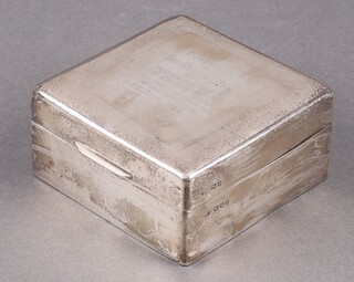A square silver cigarette box London 1919, with inscription to the top, hallmarks rubbed, 5cm h x 9cm w x 9cm d 