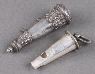 An Edwardian silver, officer's cross belt whistle with cast decoration Birmingham 1909 by Joseph Jennens & Co., 55g 