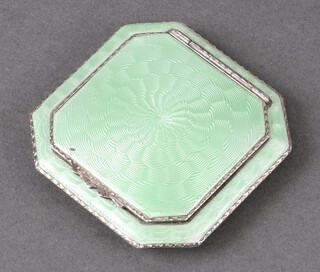 An Art Deco octagonal white metal and green guilloche enamel powder compact 5cm x 5cm 