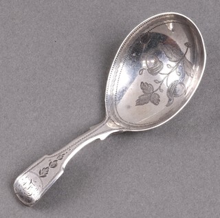 A Georgian fiddle pattern silver caddy spoon with engraved decoration and monogrammed, London 1808 by Thomas Freeth II, 12g 