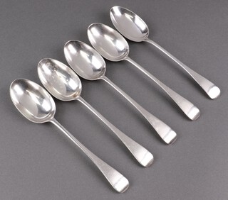 Four Edwardian silver Old English pattern table spoons, London 1905 and 1 other London 1910, all by Robert Stebbings, 321g  