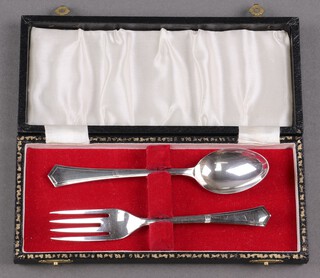 A cased silver 2 piece christening set of fork and spoon, Birmingham 1964 by Angora Silver Plate Co., 40g 