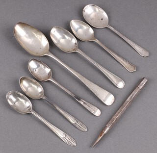 A William IV silver Old English pattern pudding spoon London 1833 (misshapen to bowl) and 6 other silver spoons, 112g, together with a silver cased propelling pencil 24g 