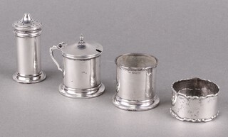A 3 piece plain silver condiment set with salt, pepper and mustard (no liner), Birmingham 1920 by Sanders and Mackenzie, together with a napkin ring, 93g