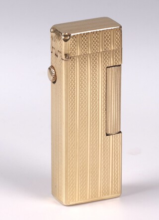 An 18ct gold jacketed Dunhill Roller gas lighter, with engine turned decoration 1968, complete with original box 
