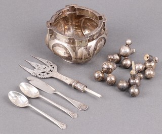 A silver sugar bowl Sheffield 1910, 2 silver coffee spoons, a silver butter knife 147g, together with a pierced silver fork head and 4 silver knife rest ends 