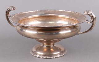 A silver twin handled pedestal bowl on spreading foot Chester 1924 by Barker Bros. (Herbert Edward Barker and Frank), 685g