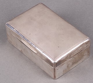 A rectangular silver cigarette box with engined turned decoration, London 1921 by Mappin & Webb 5cm h x 14cm w x 9cm d 