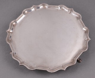 A silver salver with bracketed border on hoof feet, 25cm, Sheffield 1966, 545g 