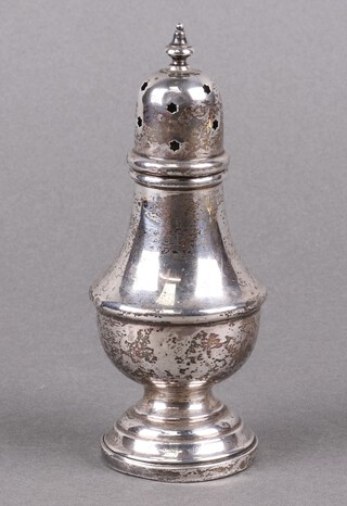 A Georgian style silver sugar caster of baluster form 13cm, marks rubbed  