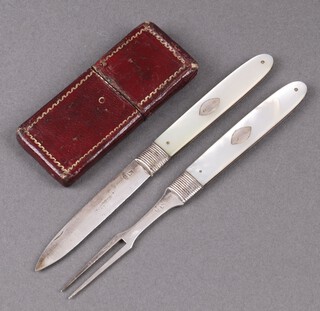 A Georgian silver travelling folding knife and a ditto 2 pronged fork with mother of pearl grips, complete with leather case 