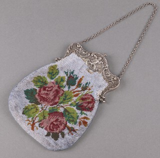 A lady's Victorian bead work bag with embossed white metal mounts with cherub decoration 