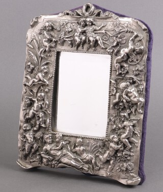 A Sterling silver covered resin easel table mirror decorated cherubs 24cm x 20cm 