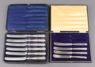 A set of 6 silver handled tea knives with steel blades, together with 4 silver bladed tea knives, cased 