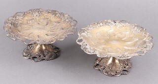 A pair of pierced 925 continental silver comports with floral decoration on pierced vinous bases, 651g, 9cm x 19cm 