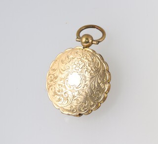 A gold testing as 14ct engraved locket with foliate decoration, 2.6cm, 7.2 grams gross