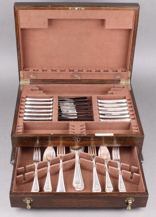 A 24 piece canteen of  0.833 Dutch silver flatware, Amsterdam, 1905 by J M Van Kempen and ZN Co., comprising 6 serving spoons, 6 dinner forks, 6 pudding spoons and 6 three pronged pudding forks, 1464g  together with a further unmarked 6 table knives and 6 tea knives with stainless steel blades by Hugh Foulerton, all contained in an associated canteen box  
