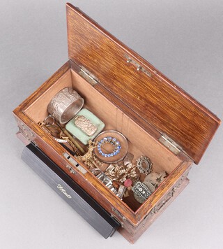A Sterling brooch in the form of a maple leaf, a quantity of costume jewellery contained in a rectangular oak box marked cigarettes 