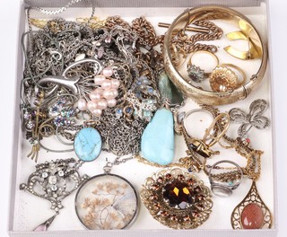 A gilt metal engraved bangle, hardstone pendants and other items of costume jewellery