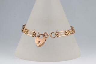 A gold marked 9ct gate link bracelet with padlock clasp, 18cm, 13.8g