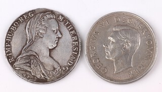 A restrike Maria Theresa thaler and a George VI 1937 crown 