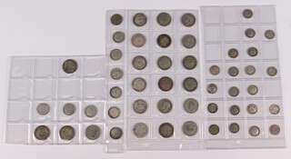 A Victorian silver shilling 1896 and 17 other shillings together with a quantity of sixpences, shillings etc, contained in plastic envelopes 