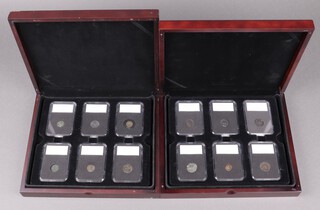 A collection of 24 Roman coins contained in a plastic slabs and in mahogany finished box 