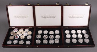 Forty eight Queen Elizabeth The Queen Mother Commonwealth silver crowns, contained in 2 mahogany finished cases, together with 18 other commemorative crowns, 1344g 