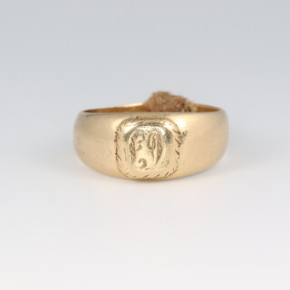 A gold marked 18ct wedding band/signet ring, engraved initials, size O, 8.9g