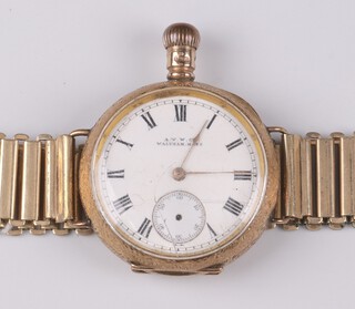 Waltham, a fob watch with enamelled dial, Roman numerals and subsidiary second hand (second hand missing), converted to a wristwatch, contained in a 9ct gold case with a gold plated bracelet, 54g including movement, glass and plated bracelet  