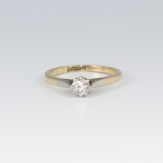 A 9ct gold and platinum solitaire diamond ring, size M 1/2, 2.5g