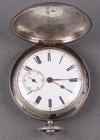 W E Munn of Sheerness on Sea, a key wind full hunter pocket watch with enamelled dial and subsidiary second hand, movement marked W E Munn 25622, contained in a silver case London 1874  (no key) 