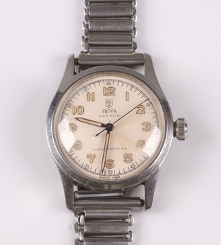 A Tudor Oyster shock resistant wristwatch with white dial, luminous Arabic numerals, back plate no. 68614453, contained in a stainless steel case with integral bracelet 