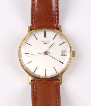 A gentleman's gilt cased Longines wristwatch with silvered dial, gilt batons, the movement marked Longines Watch Company 17 jewels 6952