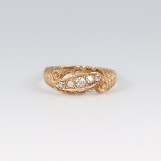 An 18ct gold 4 (ex 5) stone diamond set ring, size O 1/2, 2.3g