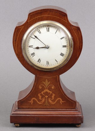An Edwardian bedroom timepiece with 8cm porcelain dial, Roman numerals, contained in an inlaid mahogany shaped case, on brass bun feet 23cm h x 14cm w x 9cm d  