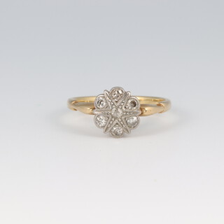 A gold marked 18ct diamond cluster ring, size L 1/2, 2.6g 