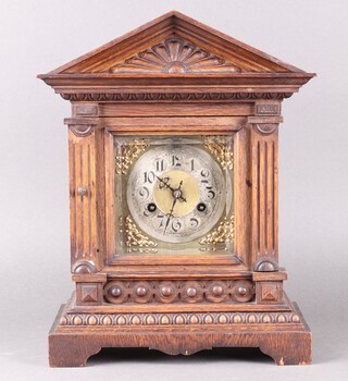 Junghans, a striking bracket clock with 14cm gilt dial, silvered chapter ring, contained in a carved oak case 39cm h x 29cm w x 17cm, complete with pendulum and key 