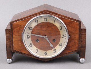 Junghans, a 1930's Art Deco chiming mantel clock with 15cm silvered dial, Arabic numerals, contained in an oak and walnut case, the back plate with crossed arrows and W77,  21cm h x 30cm w x 12cm d 