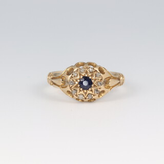An 18ct diamond and sapphire set cluster ring, size L, 3.3g