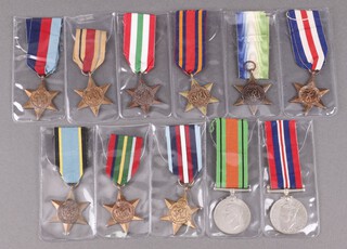 A collection of Second World War medals including 1939-45 Star, Africa Star, Italy Star, France and Germany Star,  Atlantic Star (facsimile) Burma Star, Pacific Star, Air Crew Europe Star (facsimile), Artic Star (facsimile), Defence and War medal 