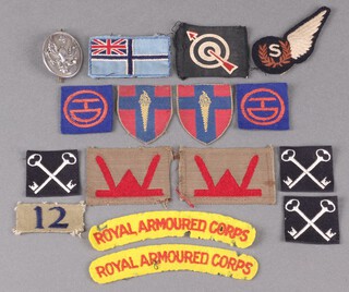 A 14th/20th King's Hussars silver NCO's sleeve badge Birmingham 1945, 16g, a cloth divisional badge 51st Highland Division, 2 cloth divisional badges 53rd Welsh division and other cloth insignia 
