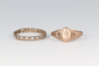 A 9ct gold signet ring (misshapen, initialled M), size M 1/2, 1.2g together with a yellow metal paste set ring 3 stones missing) size N 1/2 