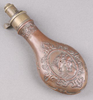 A 19th Century embossed copper and brass shot flask decorated horses heads 