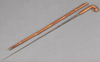 A Victorian sword stick with 65cm stiletto blade, contained in a bamboo cane marked S T Boyes 