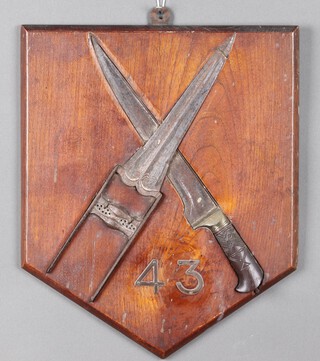 A commemorative Regimental plaque for The 43rd Erinpura Regiment with Afghan Khyder and punch dagger in saltire above 33 on a hardwood plaque, the reverse marked Regimental badge of the 43rd Regiment Captain CEE Palin IA 1897-1978 