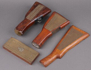 Three cribbage boards formed from rifle butts together with a brass and mahogany cribbage board decorated the badge of the Royal Army Ordnance Corps 