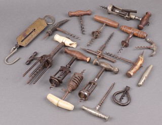 A Columbus corkscrew, a polished steel travelling corkscrew, a steel cased picnic corkscrew, 12 others and a spring balance 