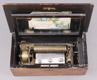 A 19th Century cylindrical musical box playing 4 aires with 11cm cylinder contained in a pine box with hinged lid, the lid decorated sea with galleon 10cm h x 27cm w x 15cm d 
